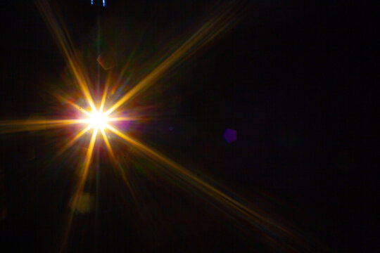 Sun flare on the black background