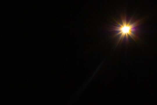 Sun flare on the black background