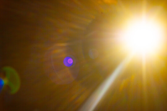 Sun flare on the black background