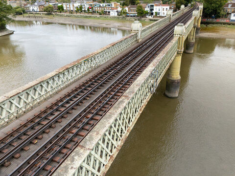 Aerial view of Kew Railway Bridge featuring iron lattice girders and railway tracks over the River Thames Richmond, Greater London, United Kingdom.