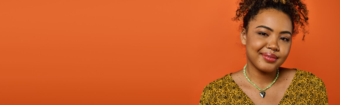 Vibrant fashion meets joyful expression in a bright setting with a stunning young woman