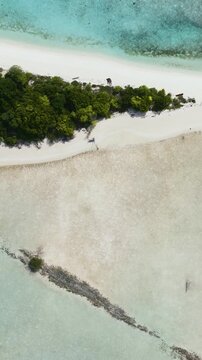 Beautiful sandy beach and blue sea. Timba Timba islet. Tun Sakaran Marine Park. Borneo, Sabah, Malaysia. Vertical video.