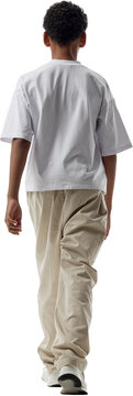 Boy walking away in rear view isolated on transparent background. Concept of directional storytelling, urban visualization, digital environment compositing.