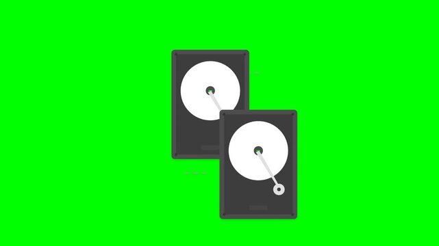 Two Hard Drives Spinning on a Green Screen Background.