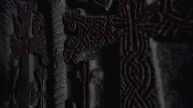 Carvings on ancient stone walls in a historic site. Detailed carvings cover ancient stone walls in a historic site. This place holds rich history and artistic expression. 
