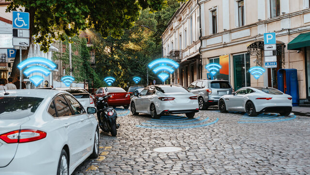 Surveillance technology tracks vehicles in a busy city area on a clear day