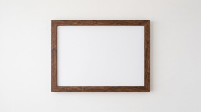 Minimalist wooden picture frame on white wall. Blank horizontal poster mockup with dark wood texture. Empty art frame for gallery display.