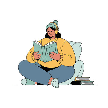A young woman sitting comfortably and reading a book.