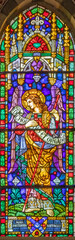 Obraz premium PISA, ITALY - JUNE 25, 2026: The St. Archangel Raphael from the stained glass in the church Chiesa di Santa Caterina by Königliche Bayerische Hofglasmalerei F. X. Zettler (1922 - 1924)