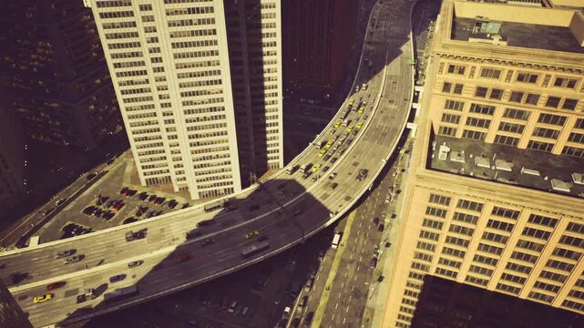 Abstract chicago city maze from birdseye, interlacing roads and rooftops create graphic composition, sparse traffic, muted tones, editorial mood, survey
