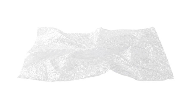 Crumpled clear plastic packaging sheet isolated on transparent background, translucent protective wrap cutout with wrinkled texture for design
