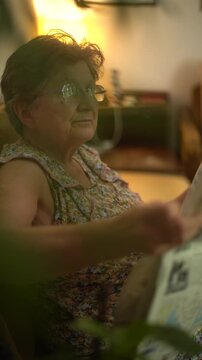 Side portrait of a senior woman reading a newspaper