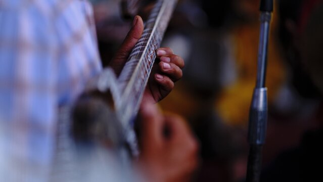 Musician Hands Playing Lute on Stage Close-up