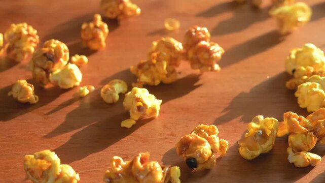 Caramel popcorn falling in slow‑motion