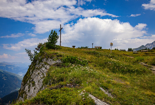 Gerlosstein summit cross in Austrian Alps with valley view