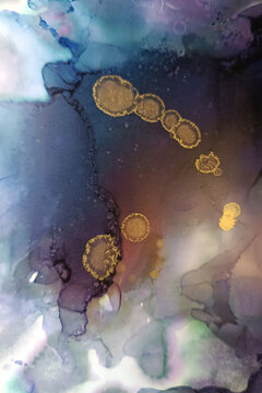 Abstract fluid art pattern in dark violet tones with  golden spots