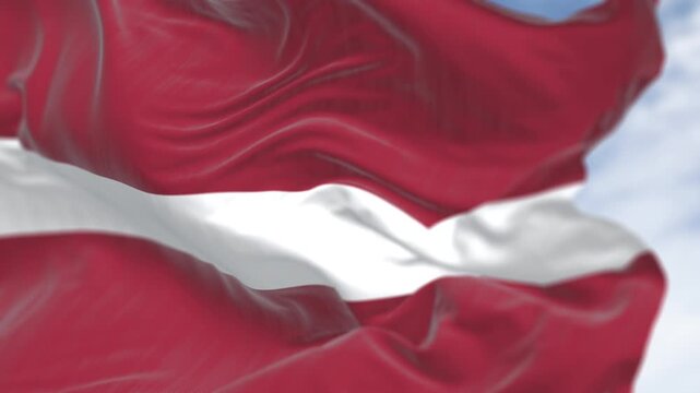 Close-up view of the Latvia national flag waving in the wind