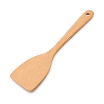 Wooden spatula on white surface