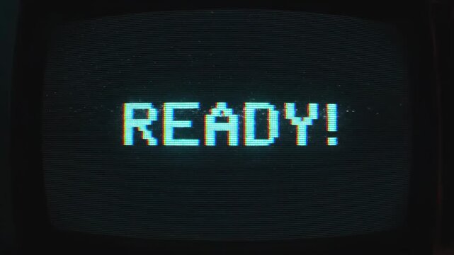 Retro 8-Bit Pixel Art READY Text Animation on Glitchy CRT Monitor Screen.