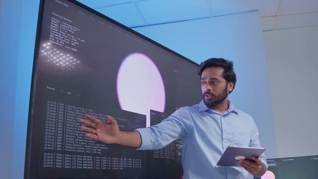 Software engineer use digital tablet Presenting system cyber security or coding on computer screen at home office. Professional programmer working use technology AI verify code or reading data develop