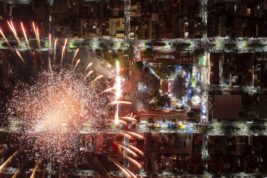 Aerial view of fireworks illuminating the night sky over the town square in Nuevo San Juan Parangaricutiro, Michoacan, Mexico.