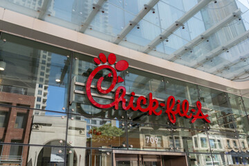 Fototapeta premium Toronto, Canada - August 5, 2026: Chick-fil-A restaurant sign on the building. Toronto, Canada. Chick-fil-A is an American fast food restaurant chain specializing in chicken sandwiches. 