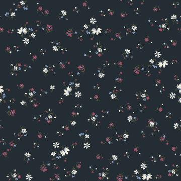 Delicate floral pattern with small white and pink blossoms scattered on a dark navy background for fabric design