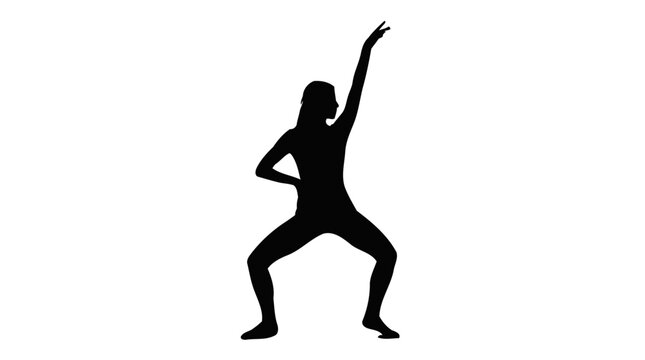 Graceful female dancer performs elegant expressive modern dance moves while wearing tight black silhouette clothing garments