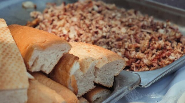 Fresh bread rolls and chopped lamb intestines prepared as ingredients for traditional Turkish kokorec. High quality 4k footage