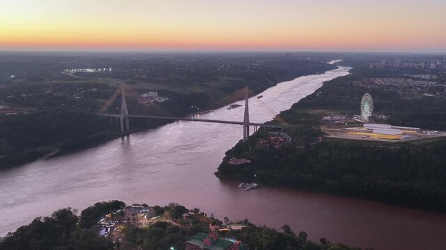 Gliding Toward the Friendship Bridge Over the Paran&aacute; River at Twilight