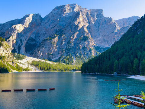 Boats on the Braies Lake in Dolomites mountains, Italy