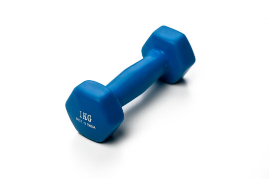Bright blue dumbbell resting on a clean surface, ready for an energizing workout session