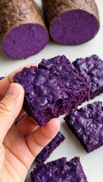 Fudgy ube brownies with rich purple yam flavor and chewy texture showcased alongside fresh tubers