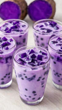 Purple ube boba milk tea with tapioca pearls, jelly cubes, purple yam for cafe menus, beverage promotion, recipe content, served chilled in multiple glasses