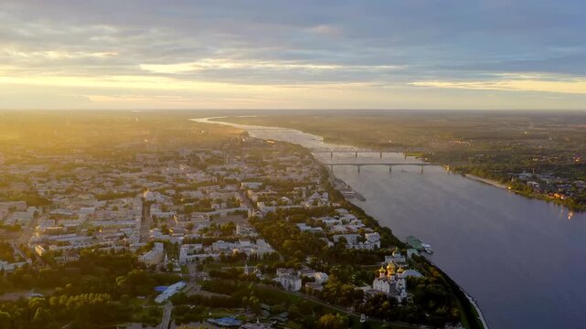 Yaroslavl, Russia. Monument to the 1000th Anniversary, 20-meter granite stele crowned with a gilded double-headed eagle, Drone footage at sunset where the Kotorosl meets the Volga. Drone footage