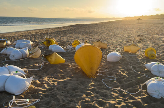 buoys with weights on the ocean shore