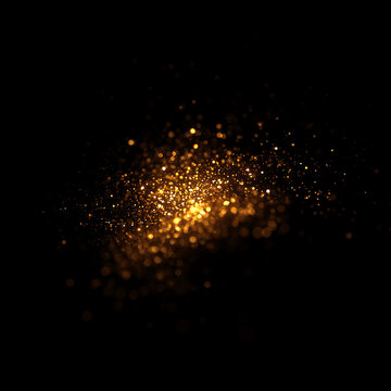 Golden particle dust explosion effect. Sparkling gold glitter cloud on dark background. Abstract magic bokeh light trail, magical and festive sparkling effect ideal for overlays and backdrops