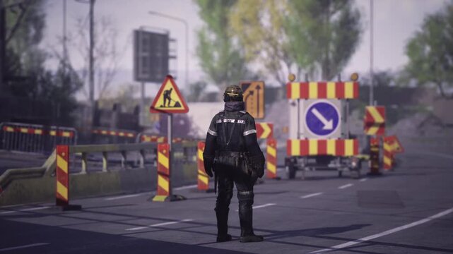 Incident control officer at closed lane directing vehicles away from hazard zone, reflective striping visible, portable barriers and directional arrows, calm