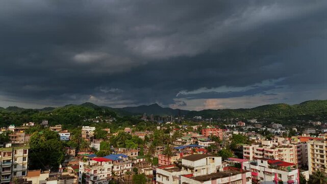 In aerial view, dark storm clouds over the city