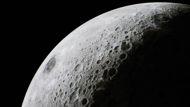 A breathtaking view of the moon shows its rugged terrain, dotted with craters under the dark expanse of space. This celestial body captures the imagination of stargazers during quiet nights.