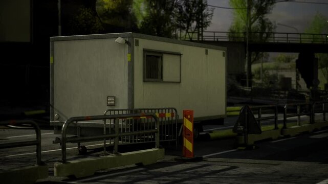 A nondescript trailer rests quietly on an empty city street. Surrounding barriers and sparse trees hint at a time of transition. The gray atmosphere deepens the air of solitude around this scene.