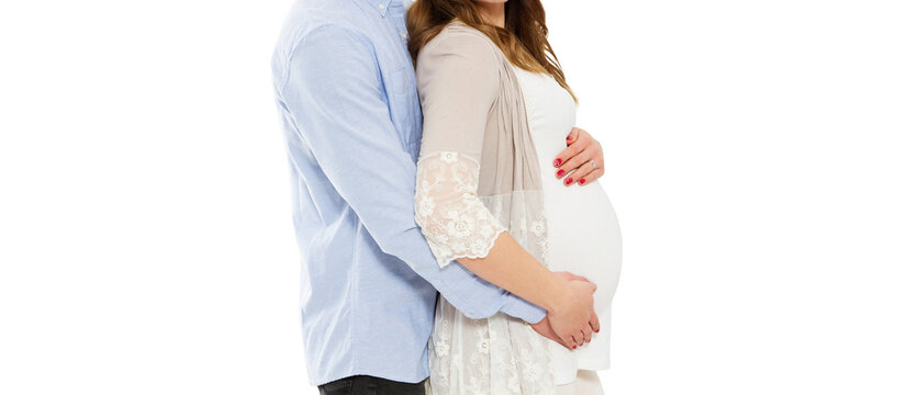 young pregnant woman. Young pregnant woman with husband isolated on white - cropped image. Beautiful Young Pregnant Couple Sitting. Expecting Parents Maternity Portrait. space for text.