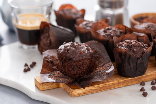 Chocolate chip muffins mini size on a board served with milk, double chocolate muffins, dessert idea
