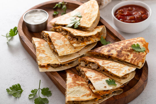 Ground beef and cheese quesadillas on a serving plate