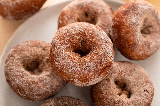 Pumpkin or apple cider donuts covered with cinnamon sugar