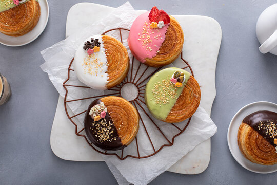 Trendy round croissants with a variety of fillings and glaze