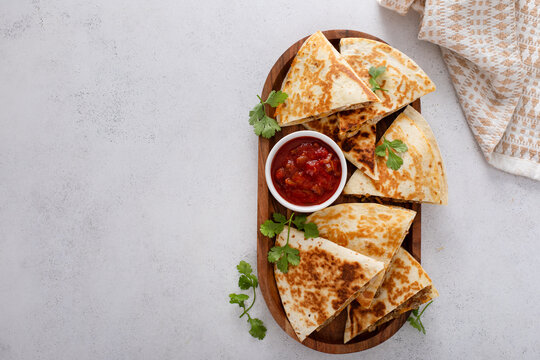 Ground beef and cheese quesadillas on a serving plate