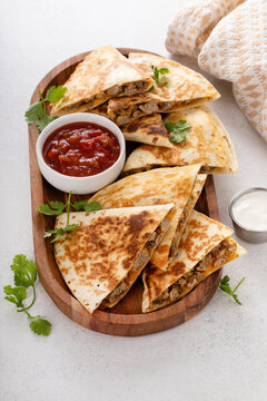 Ground beef and cheese quesadillas on a serving plate
