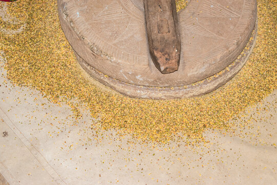 indian quern stone use to grind grains or pulses in old age at village