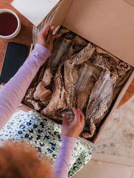 Woman examining her order from online store 